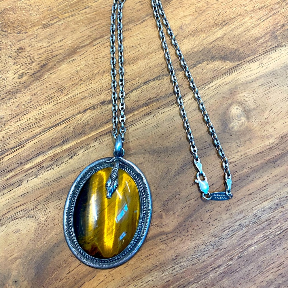 Striking tigers eye and sterling silver pendant with snake head design